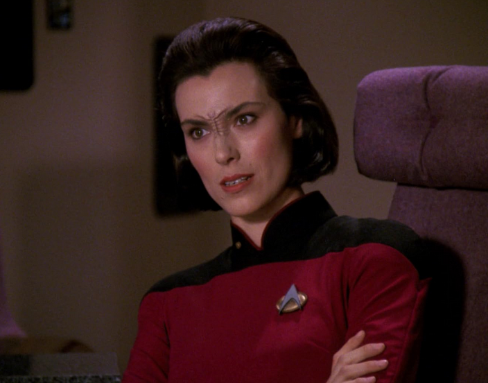 ‘Star Trek: The Next Generation’ Cast: What Are They Doing in 2025? 12 Ro Laren in her red Star Trek suit talking to someone.