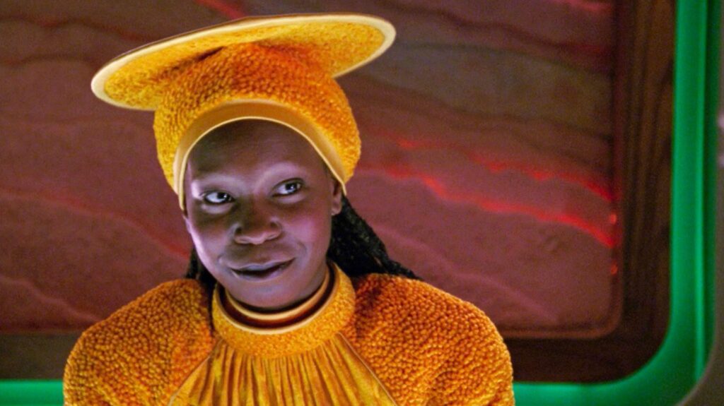 ‘Star Trek: The Next Generation’ Cast: What Are They Doing in 2025? 14 Guinan wearing a shiny orange hat and out with a smile.