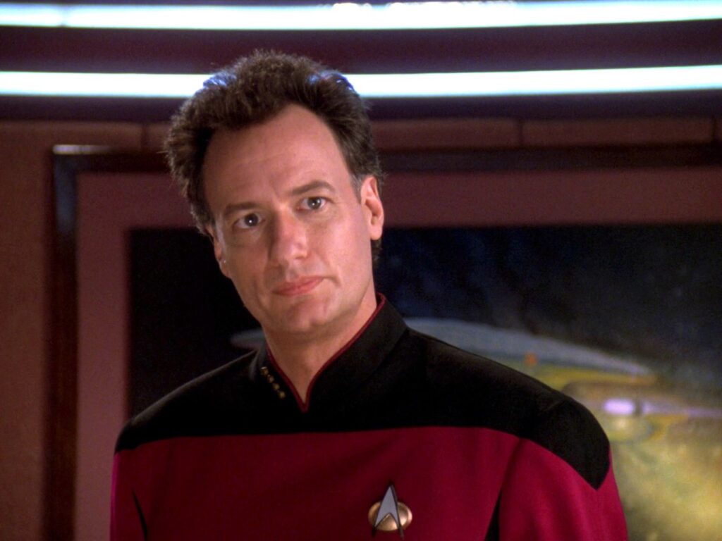 ‘Star Trek: The Next Generation’ Cast: What Are They Doing in 2025? 15 Q looking at someone in a still from Star Trek