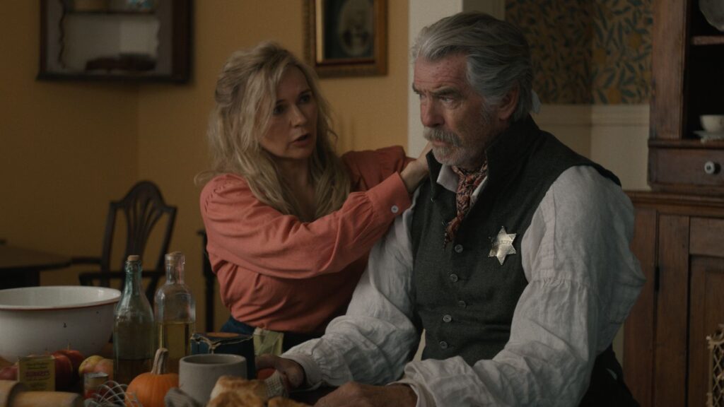 The Unholy Trinity Review — Blasphemy of a Once Proud Genre 2 A woman tends to a man's wounds in The Unholy Trinity