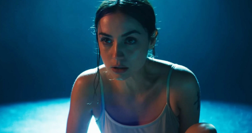 ‘Ballerina’ Box Office: Ana de Armas Scores the Third-Biggest Collection for Any ‘John Wick’ Movie in History 10 Eve Macarro is in a wet tank top sits under a spotlight, looking exhausted but focused.
