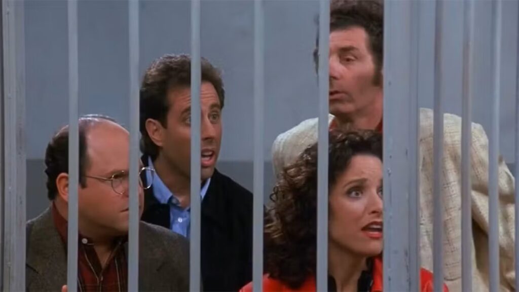 10 Insanely Popular TV Shows From the ‘90s You Can Stream on Netflix 4 Seinfeld finale scene showing the main characters behind bars.