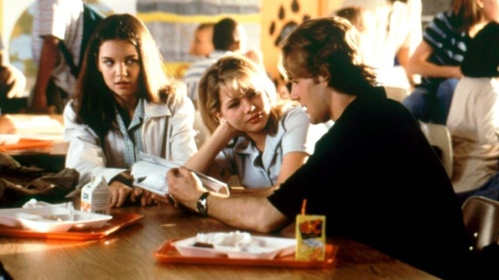 10 Insanely Popular TV Shows From the ‘90s You Can Stream on Netflix 24 Scene from Dawson's Creek showing Joey, Jen, and Dawson sitting at a table in what appears to be a cafeteria.
