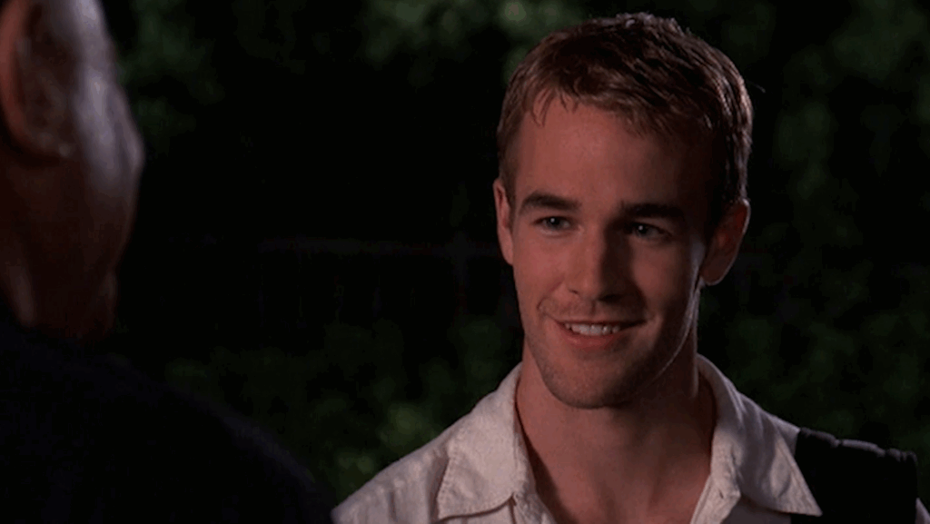 10 Insanely Popular TV Shows From the ‘90s You Can Stream on Netflix 23 Close-up portrait of Dawson Leery from Dawson's Creek smiling at the camera in an outdoor nighttime setting.