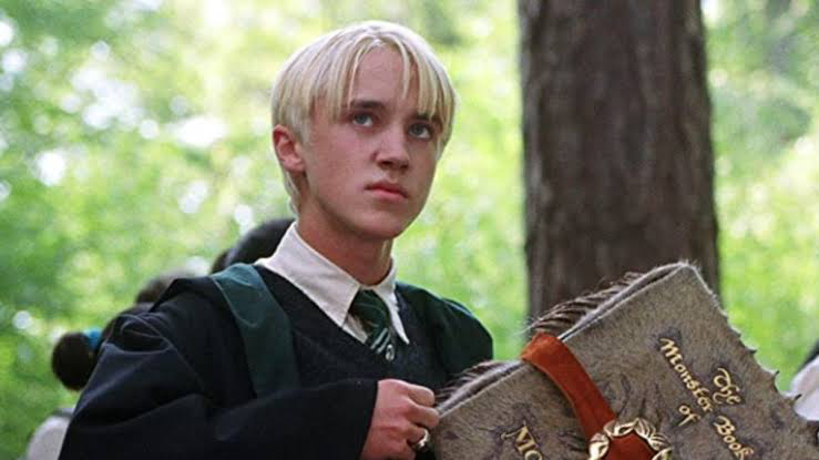 Nick Frost Calls Out J.K. Rowling on Anti-Trans Views and I Think Harry Potter May Have Found Its Perfect Hagrid 10 Tom Felton holding the monster book of monsters in Prisoner of Azkaban