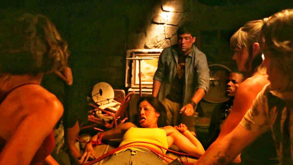 New Taylor Sheridan Horror Franchise Movie Must Avoid Becoming ‘Yellowstone With a Chainsaw' 5 A group of people holding a girl down in Vile.