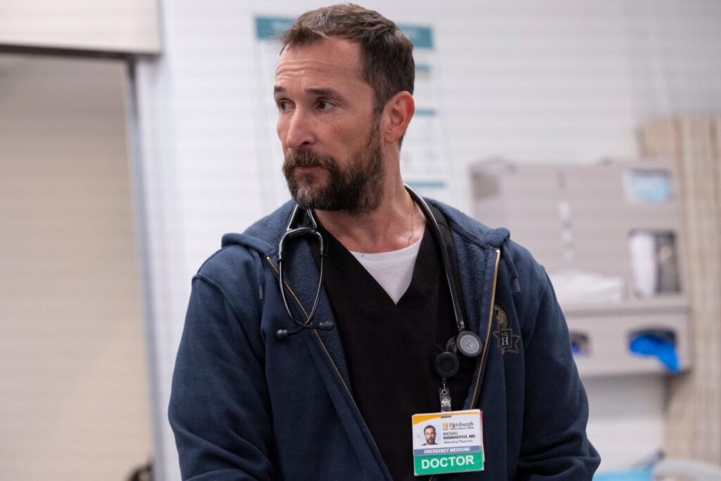 ‘The Pitt’ Season 2: Everything We Know So Far 4 Noah Wyle looking across the room in his doctor's uniform