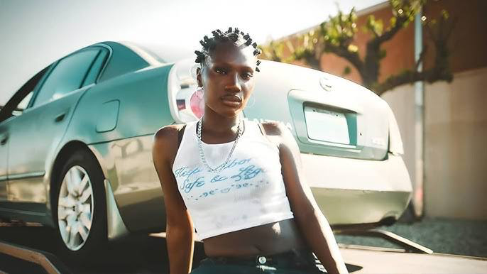 Doechii Joins Jessica Alba and Eva Longoria to Support Protesters and Criticize Donald Trump in LA Riots 1 Florida rapper Doechii posing in front of a car