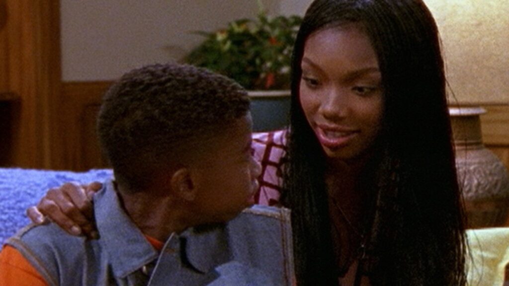 10 Insanely Popular TV Shows From the ‘90s You Can Stream on Netflix 32 Scene from "Moesha" showing Moesha and Myles - sitting close together.