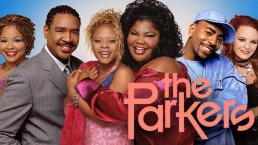 10 Insanely Popular TV Shows From the ‘90s You Can Stream on Netflix 46 Cast promotional photo for "The Parkers" TV show featuring seven actors posed together against a blue sky background, with the show's logo prominently displayed in red letters.