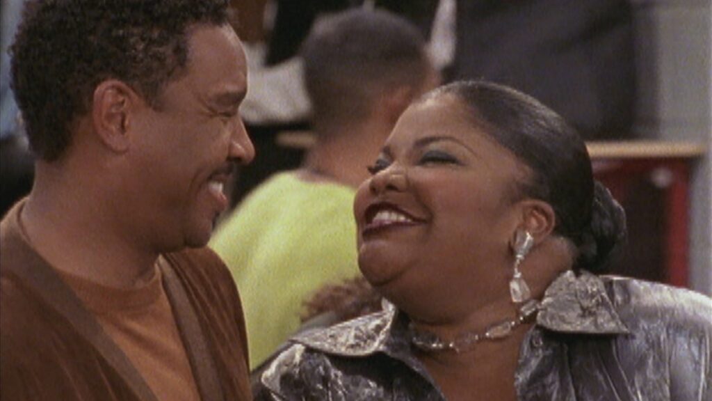 10 Insanely Popular TV Shows From the ‘90s You Can Stream on Netflix 47 Scene from "The Parkers" showing Professor Stanley and Nikki in an intimate moment - Professor Stanley in a brown sweater and Nikki in a sparkly silver top looking at each other lovingly