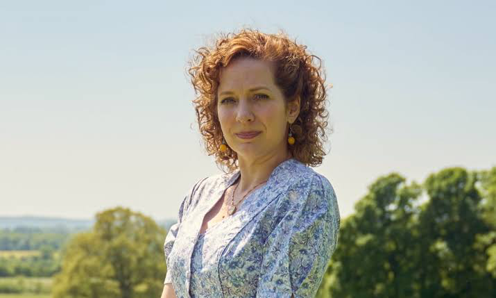 Katherine Parkinson’s 95% Rated Show May Convince You She Can Replace Original Molly Weasley Actress in Harry Potter 1 Katherine Parkinson standing in the field wearing a white dress as Lizzie in Rivals
