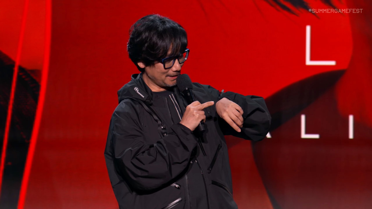 Hideo Kojima’s Biggest Fear Is an Inevitable Monster We All Fall Victim To 28 Hideo Kojima at Summer Game Fest 2025 looking at his watch.