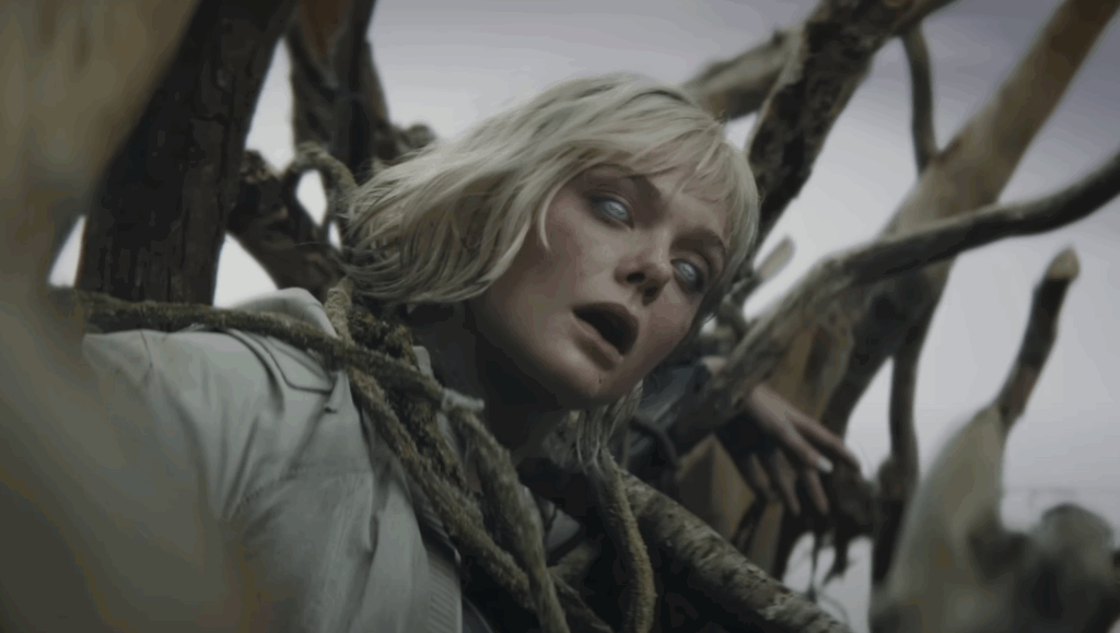 After ‘Predator: Killer of Killers’, Dan Trachtenberg Will Be Foolish to Ignore the Grendel King in Future Crossover 1 Ellie Fanning, tangled in a tree in Predator: Badlands.