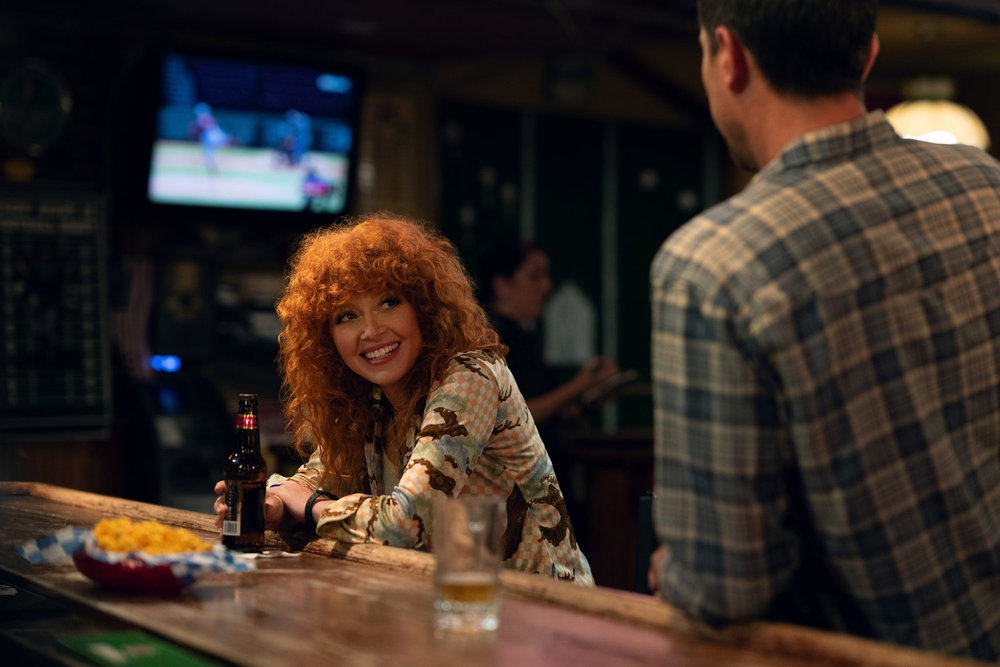Poker Face — "The Sleezy Georgian" — Season 2 Episode 8 Spoiler Recap and Review 4 POKER FACE -- Hometown Hero Episode 205 -- Pictured: (l-r) Natasha Lyonne as Charlie Cale, Simon Rex as Russ Waddell -- (Photo by: Sarah Shatz/PEACOCK)