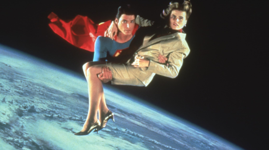  Superman is flying through space, carrying Lacy.