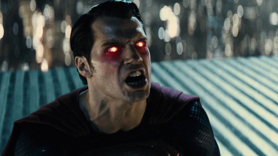 Superman is shown with glowing red eyes and an open mouth.