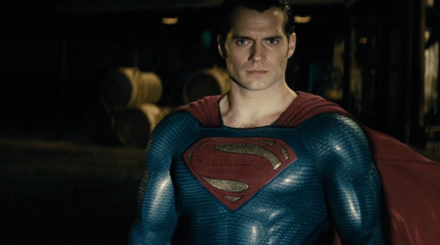 Superman stands confidently in his blue and red suit, looking directly at the camera.