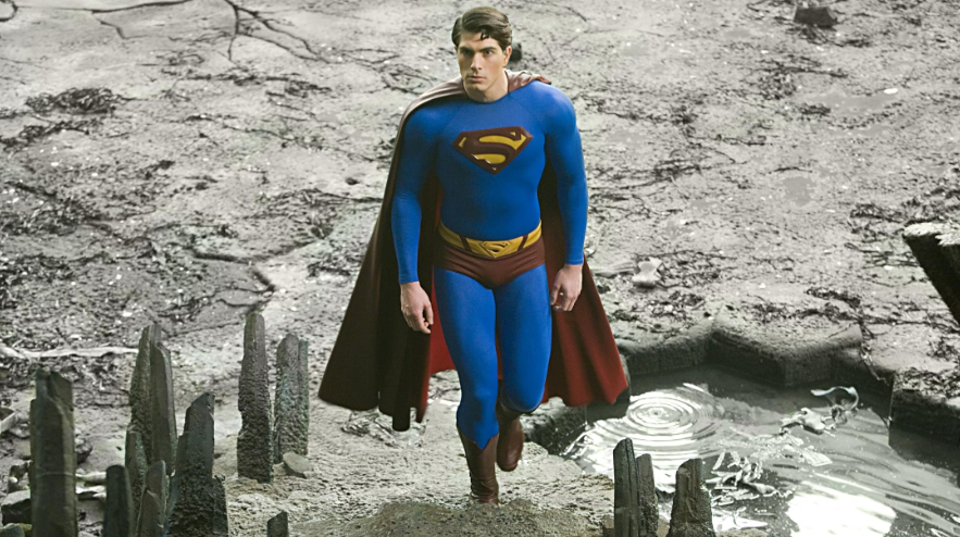 Superman is walking up the rocky stairs.