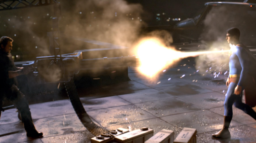 Superman is standing opposite a man firing a weapon that emits a powerful beam of light.
