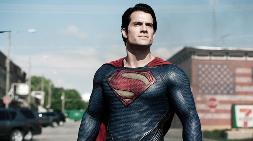 Superman is standing confidently in his suit.
