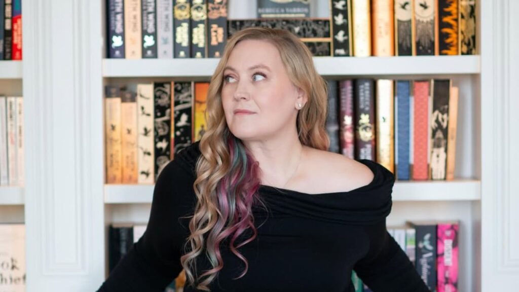 ‘Fourth Wing’ on Prime Video: Everything We Know So Far 4 Rebecca Yarros posing infront of her authored books