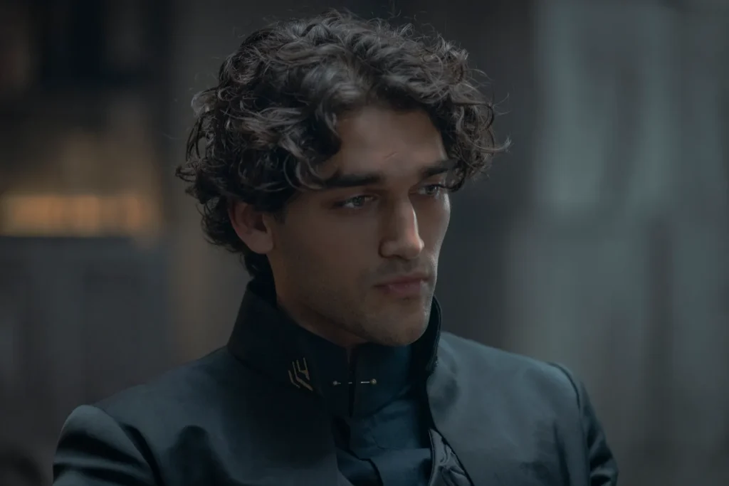 ‘Fourth Wing’ on Prime Video: Everything We Know So Far 5 Josh Heuston staring at a distance with a serious expression on his face