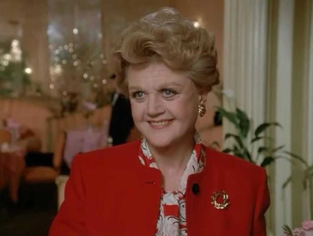 Angela Lansbury looks beautiful in a red suit.