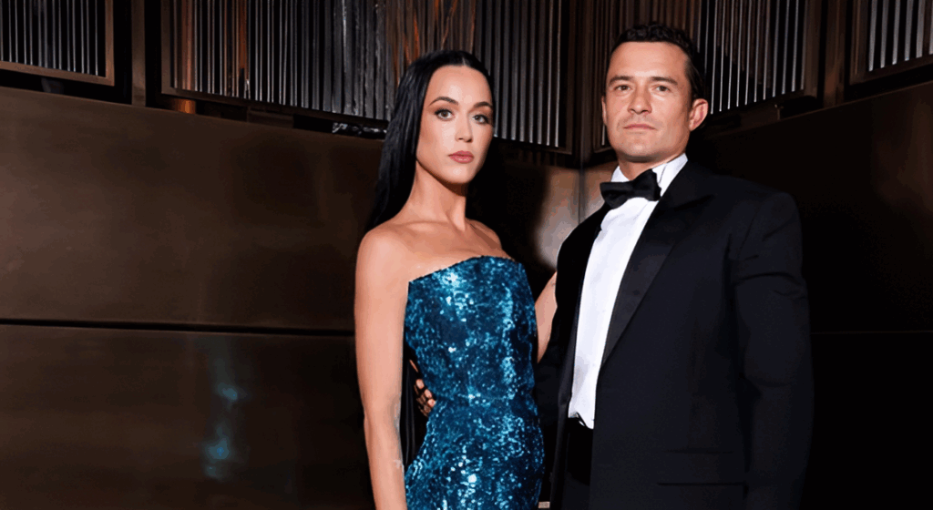 Orlando Bloom’s Relationship With Katy Perry: What Went Wrong 4 Katy Perry and Orlando Bloom posing together at a formal event. Perry is wearing a strapless blue sequined gown and Bloom is in a black tuxedo with bow tie. They are standing close together.