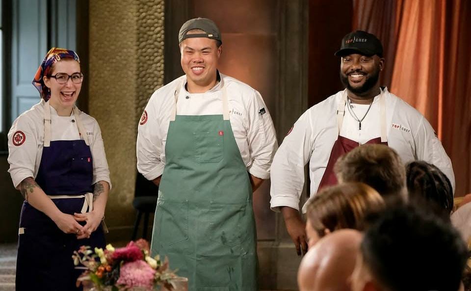 Top Chef Season 22 Finale: I Prayed for Tristen After His “Un-Colonize” Goal Struck Deep in Deserved Win 1 Baily, Shuai, and Tristen smiling while standing in front of the judges in Top Chef.
