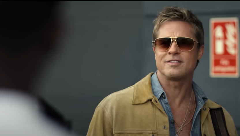 Brad Pitt Reveals if Tom Cruise Beat Him at Racing After His Only Condition To Work Together Again 4 Brad Pitt in a still from F1 trailer smiling