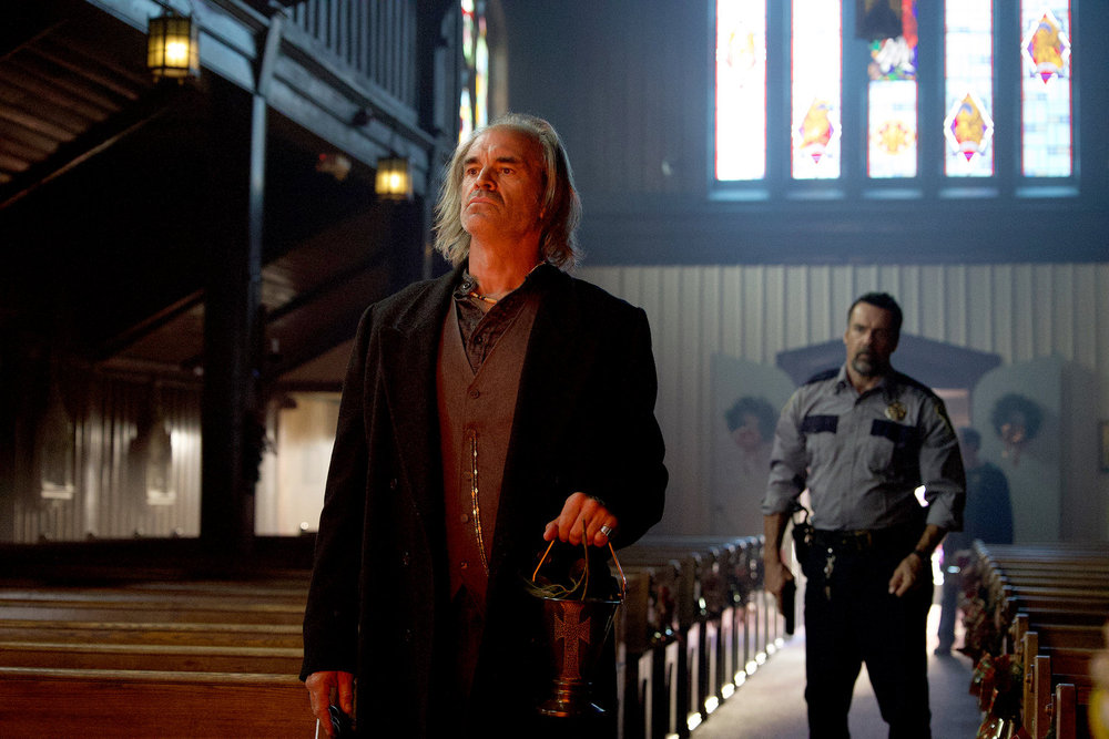 Aaron B. Koontz REVIVAL -- "Reality Check" Episode 103 -- Pictured: (l-r) Steven Ogg as Blaine Abel, David James Elliott as Sheriff Wayne Cypress -- (Photo by: Mathieu Savidant/Lavivier Productions/SYFY)