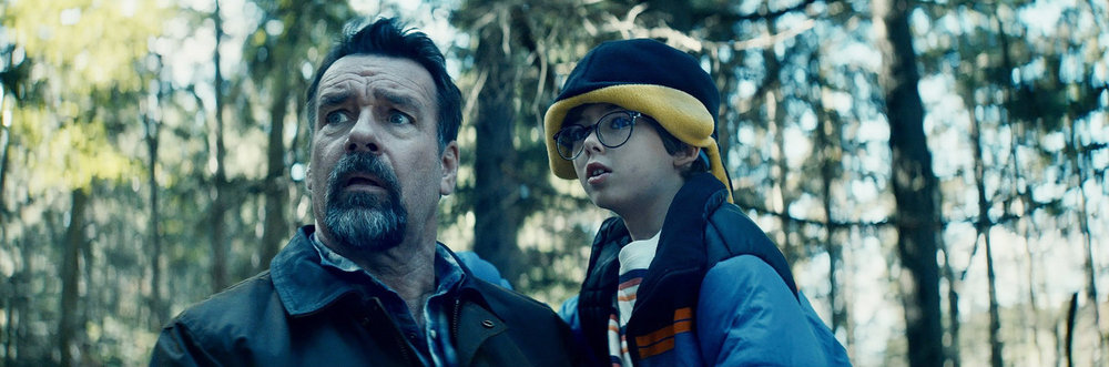 Aaron B. Koontz - REVIVAL -- "Keeping Up Appearances" Episode 102 -- Pictured: (l-r) David James Elliott as Sheriff Wayne Cypress, Hudson Wurster as Cooper Cypress -- (Photo by: Lavivier Productions/SYFY)