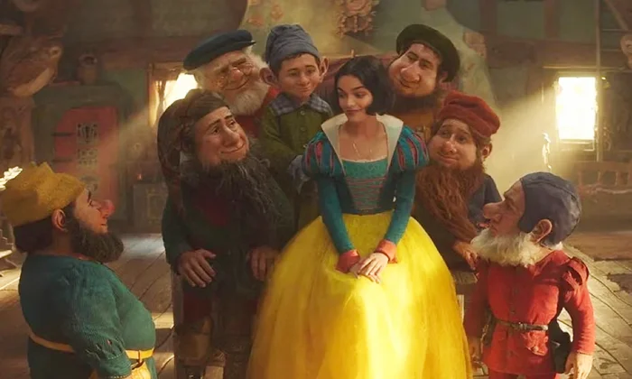 “F*ck you Peter Dinklage”: WWE Star “Hates” Game of Thrones Star for Costing Him Jobs 2 Rachel Zegler as Snow White, surrounded by the Seven Dwarfs