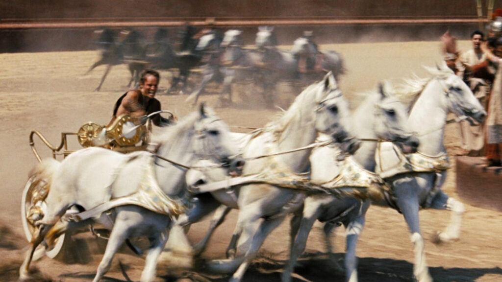 Charlton Heston's 87%-Rated Epic Let a Near-Death Stunt Accident Make the Final Cut 1 Charlton Heston riding the horses in the chariot race in Ben-Hur
