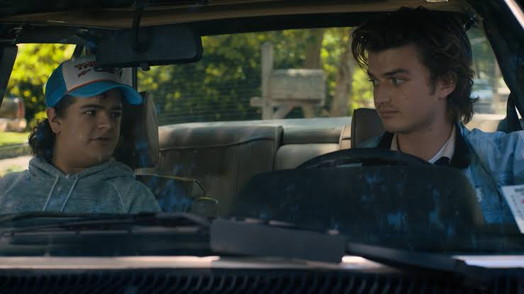 Stranger Things Season 4 Turns Best Friend Banter Into Lowkey Bullying for Steve 1 Steve and Dustin in the car scene from Stranger Things Season 4