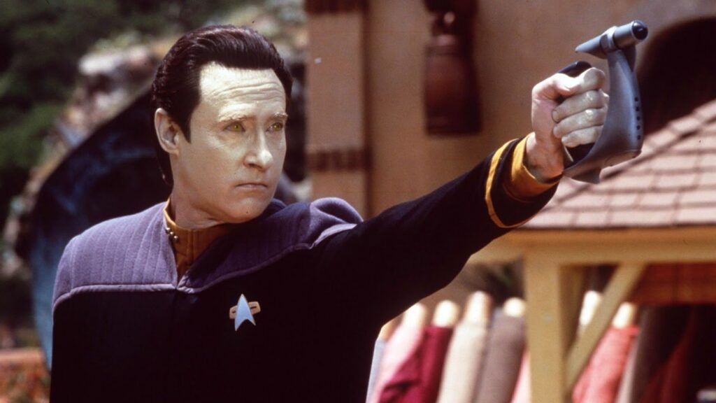 31 Years Later, Star Trek's Most Hated Episode Proves How TNG Wasted a Godlike Talent Like Brent Spiner 1 Brent Spiner fires a ray gun in Star Trek: TNG