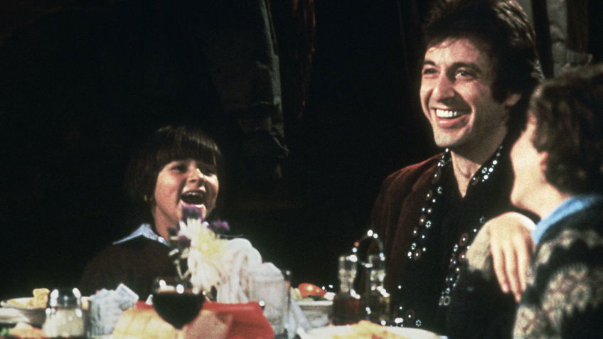 10 Overlooked Al Pacino Movies That Deserve More Attention 7 Al Pacino sits at a dining table surrounded by kids