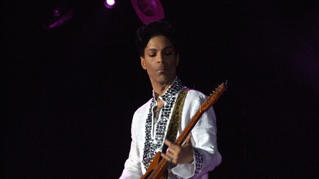 Prince playing the guitar