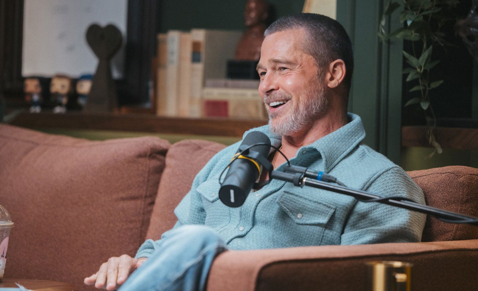 Brad Pitt smiling during his appearance on Armchair Expert with Dax Shepard