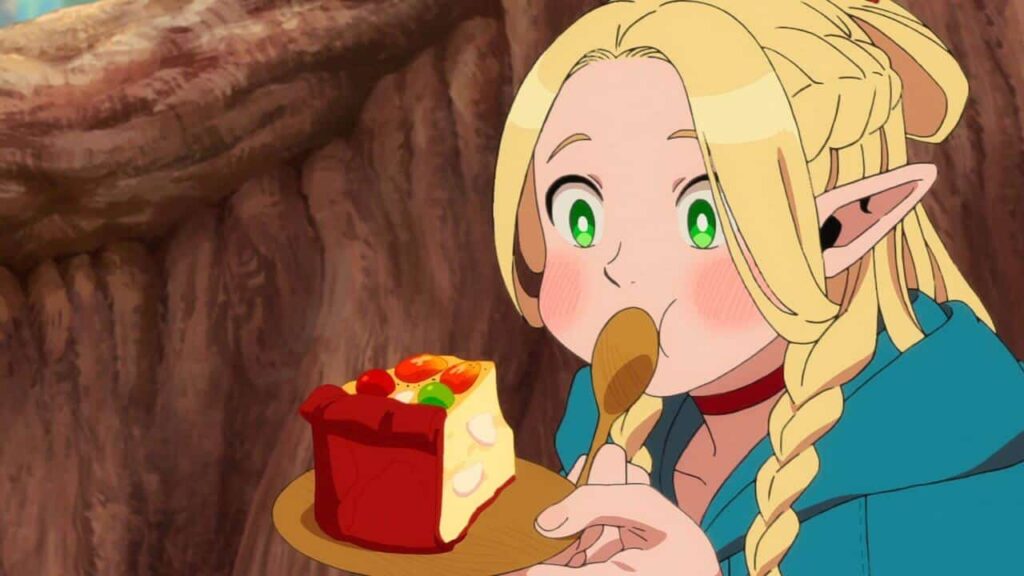 Marcille eating cake in Delicious in Dungeon.