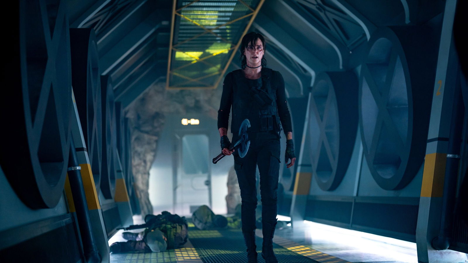 A woman walks down a hallway intensly