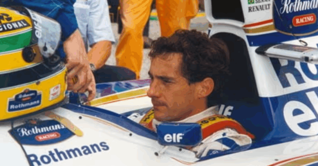 Aryton Senna sitting in an F1 car.