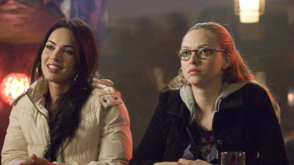 25 Interesting Movies with RT Score Below 50% 7 Jennifer and Anita sitting in a bar