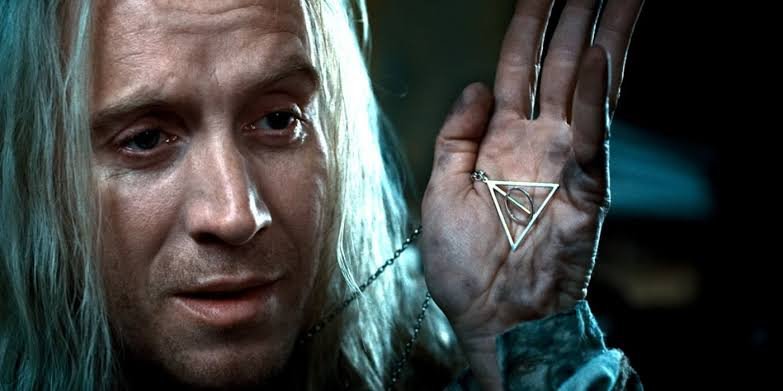 I Rewatched Harry Potter and Realized They Forgot the Plot Device in the Title 1 Xenophilius Lovegood explaining the sign of the Deathly Hallows