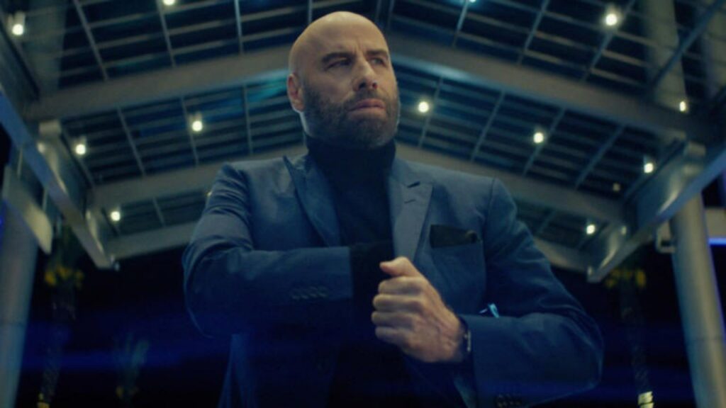 Tom Cruise's Beef With John Travolta Comes to an End—It Was Never as Intense as the Brad Pitt Feud 1 John Travolta in a still from High Rollers