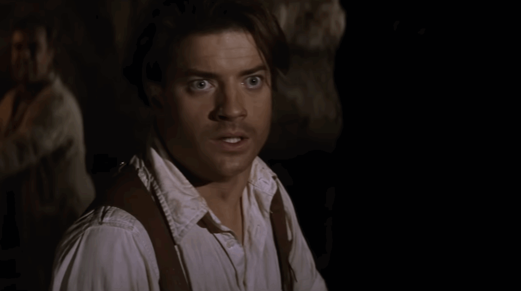 Branden Fraser in a white shirt and brown vest. 