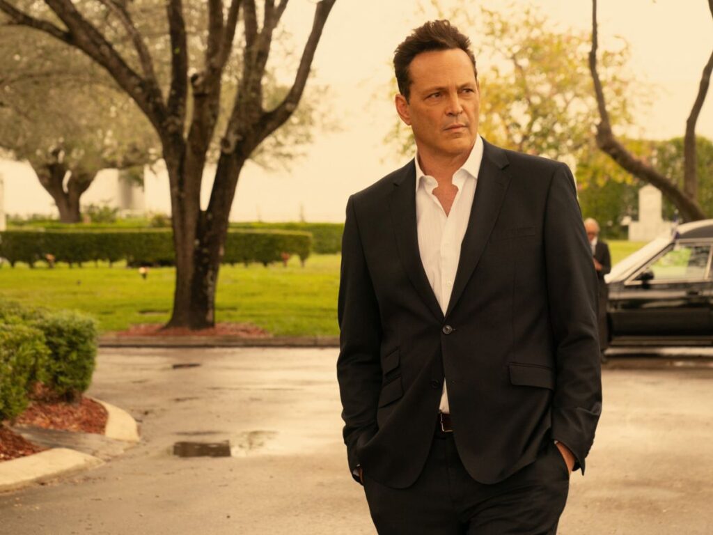 Vince Vaughn's character standing in a black suit in Bad Monkey