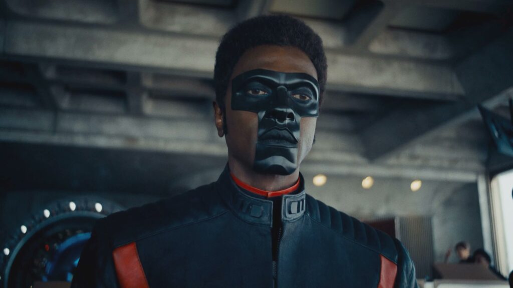 One Superman Scene Has Convinced Me That James Gunn’s Plan for a Superhero Spinoff Series Is a Home Run 1 Edi Gathegi as Mister Terrific, looking at someone in a still from Superman