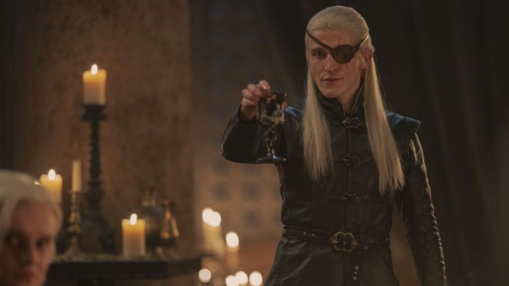Prince Aemond holding a glass of wine in House of the Dragon